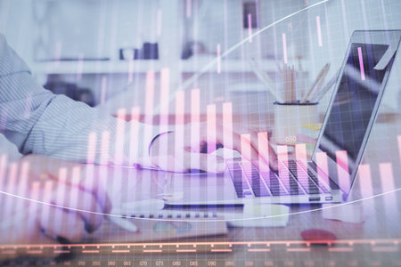 Multi exposure of stock market graph with man working on laptop on background. Concept of financial analysis.の写真素材