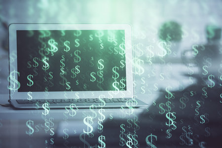Stock market graph on background with desk and personal computer. Double exposure. Concept of financial analysis.の写真素材