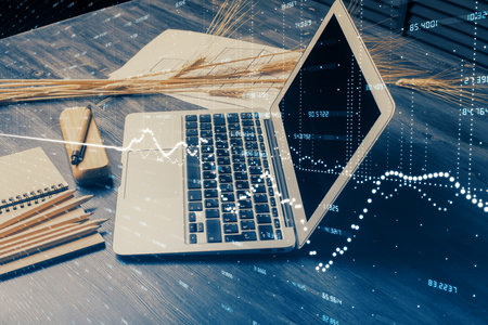 Financial graph colorful drawing and table with computer on background. Double exposure. Concept of...