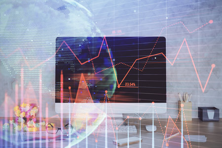 Forex graph hologram on table with computer background. Double exposure. Concept of financial markets.の写真素材