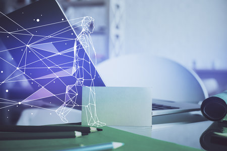 Desktop computer background in office and start up theme hologram drawing. Double exposure. Startup concept.の写真素材