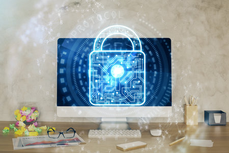 Double exposure of desktop with computer and lock icon hologram. Concept of data safety.の写真素材