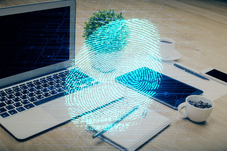 Computer on desktop in office with finger print drawing. Double exposure. Concept of business data...