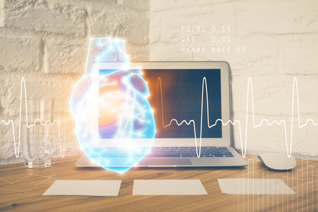 Desktop computer background and heart drawing. Double exposure. Medical study and healthcare...