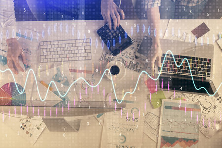 Multi exposure of man and woman working together and financial chart hologram. Business concept. Computer background.の写真素材