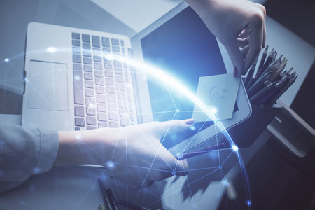 Double exposure of woman hands typing on computer and social network theme hologram drawing. People media concept.の写真素材