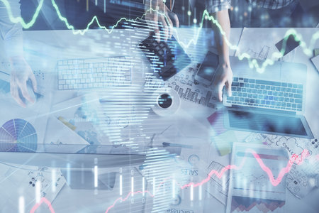 Multi exposure of man and woman working together and financial chart hologram. Business concept. Computer background.の写真素材