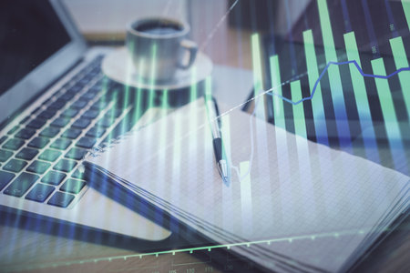 Double exposure of forex chart drawing and desktop with coffee and items on table background. Concept of financial market tradingの写真素材