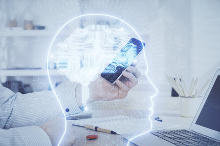Double exposure of man's hand holding and using a digital device and brain hologram drawing. Data concept.の写真素材