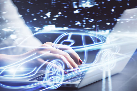 Double exposure of woman hands typing on computer and automobile theme drawing. High Tech concept.の写真素材