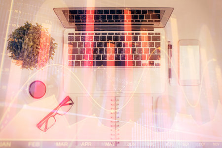 Multi exposure of forex chart drawing over table background with computer. Concept of financial research and analysis. Top view.の写真素材