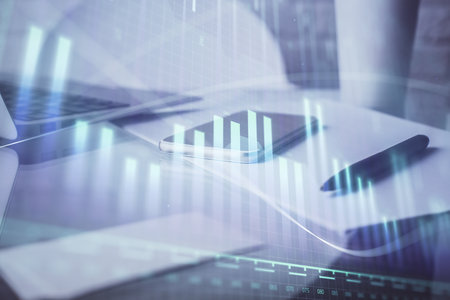 Double exposure of forex graph drawing and cell phone background. Concept of financial data analysisの写真素材