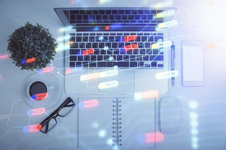 Double exposure of data drawing hologram over topview of study desk background with computer. Concept of Ai.の写真素材