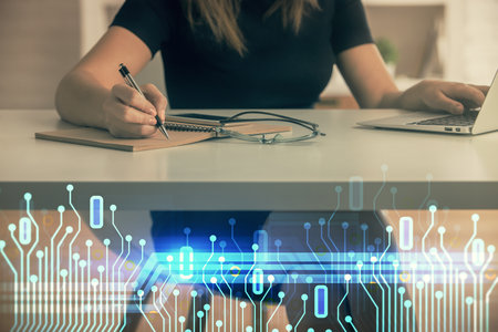 Multi exposure of woman hands working on computer and data theme hologram drawing. Tech concept.の写真素材