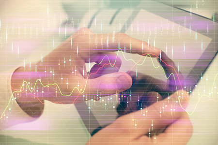 Multi exposure of man's hands holding and using a phone and financial chart drawing. Market analysis concept.の写真素材
