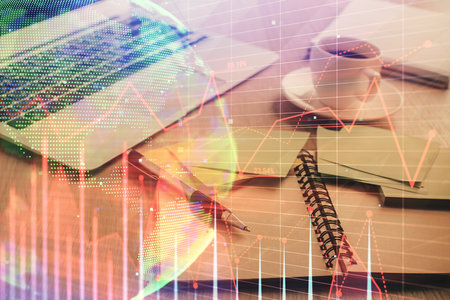 Multi exposure of forex graph drawing and desktop with coffee and items on table background. Concept of financial market tradingの写真素材