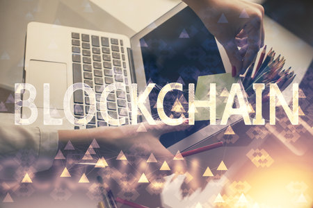 Double exposure of woman hands typing on computer and crypto market theme hologram drawing....
