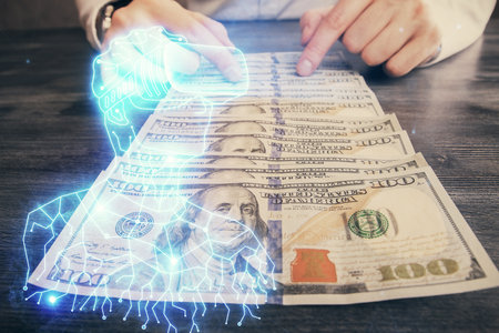 Multi exposure of vr glasses drawing hologram and USA dollars bills and man hands.の写真素材