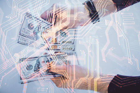 Multi exposure of Tech drawing hologram and USA dollars bills and man hands. Technology concept.の写真素材