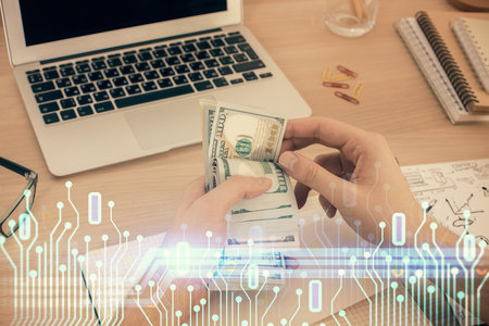 Multi exposure of technology drawing hologram and us dollars bills and man hands. Data conceptの写真素材