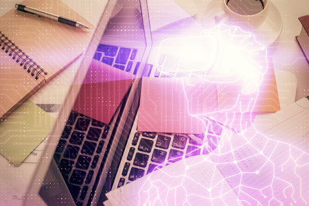 AR hologram drawings over computer on the desktop background. Top view. Multi exposure. Concept of augmented reality.の写真素材