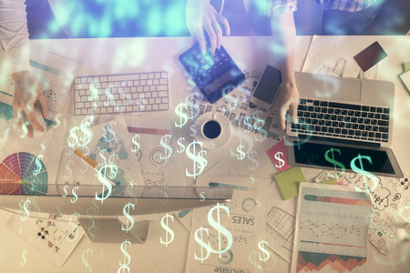 Multi exposure of man and woman working together and financial chart hologram. Business concept. Computer background.の写真素材