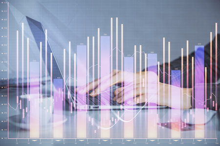 Double exposure of businesswoman hands typing on computer and forex graph hologram drawing. Financial analysis concept.の写真素材