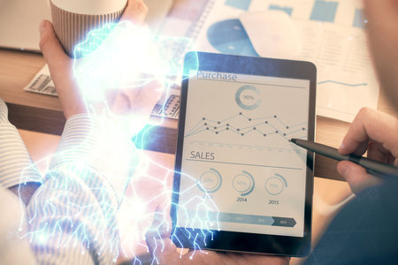 Double exposure of man's hands holding and using a digital device and AR glasses drawing. Virtual reality concept.の写真素材