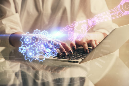 Double exposure of woman hands working on computer and data theme hologram drawing. Tech concept.の写真素材