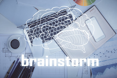 Start up theme drawing over computer on the desktop background. Top view. Double exposure. Brainstorm concept.の写真素材