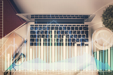 Multi exposure of financial chart drawing over table background with computer. Concept of research. Top view.の写真素材