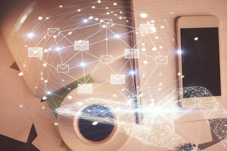 Multi exposure of envelop technology theme drawing over table with phone. Top view. Concept of electronic mail.の写真素材