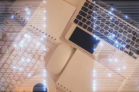 Technology hologram drawing over computer on the desktop background. Top view. Double exposure. Tech concept.の写真素材
