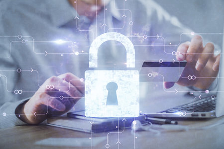 Double exposure of man hands holding a credit card and lock drawing. E-commerce and technology...