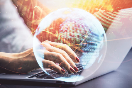 Multi exposure of woman hands typing on computer and business theme hologram drawing. Success concept.の写真素材