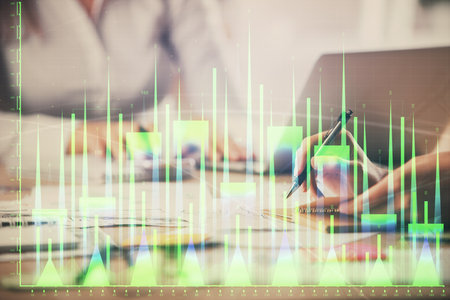 Multi exposure of woman hands typing on computer and forex chart hologram drawing. Stock market analysis concept.の写真素材