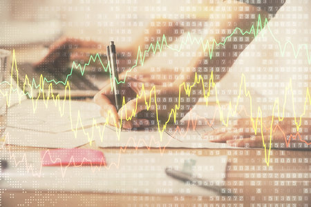 Multi exposure of woman hands typing on computer and financial chart hologram drawing. Stock market analysis concept.の写真素材