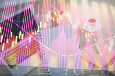 Double exposure of businesswoman hands typing on computer and forex chart hologram drawing. Financial analysis concept.の写真素材