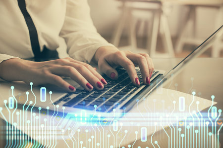 Multi exposure of woman hands working on computer and data theme hologram drawing. Tech concept.の写真素材