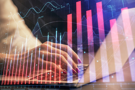 Double exposure of businesswoman hands typing on computer and forex chart hologram drawing. Financial analysis concept.の写真素材