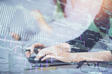 Multi exposure of woman hands typing on computer and financial graph hologram drawing. Stock market analysis concept.の写真素材
