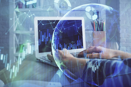 Double exposure of woman hands typing on computer and forex chart hologram drawing. Stock market invest concept.の写真素材