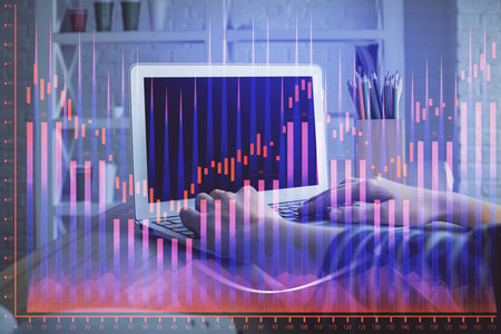 Double exposure of woman hands typing on computer and forex chart hologram drawing. Stock market invest concept.の写真素材