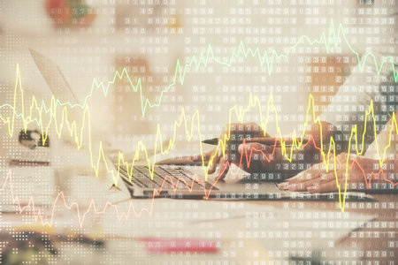 Multi exposure of woman hands typing on computer and financial chart hologram drawing. Stock market analysis concept.の写真素材