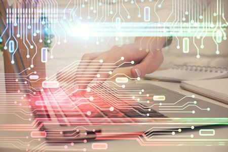 Double exposure of woman hands working on computer and data theme hologram drawing. Tech concept.の写真素材