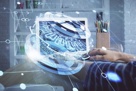 Double exposure of woman hands working on computer and data theme hologram drawing. Tech concept.の写真素材