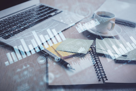 Multi exposure of forex graph drawing and desktop with coffee and items on table background. Concept of financial market tradingの写真素材