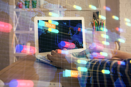 Double exposure of woman hands working on computer and data theme hologram drawing. Tech concept.の写真素材