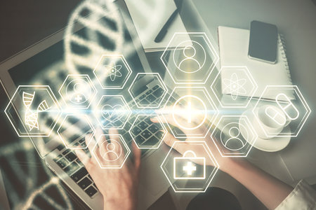 Double exposure of woman hands typing on computer and DNA hologram drawing. Medical education concept.の写真素材