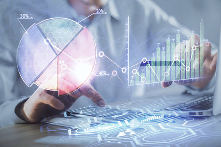 Double exposure of man hands holding a credit card and Forex graph drawing. Stock trading and digital fintech in Internet E-commerce concept.の写真素材